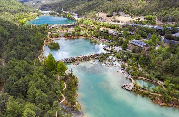 This aerial photo taken on May 17, 2023 shows the summer scenery of Lanyue (Blue Moon) Valley in Lijiang, southwest China's Yunnan Province. (Xinhua/Chen Xinbo)